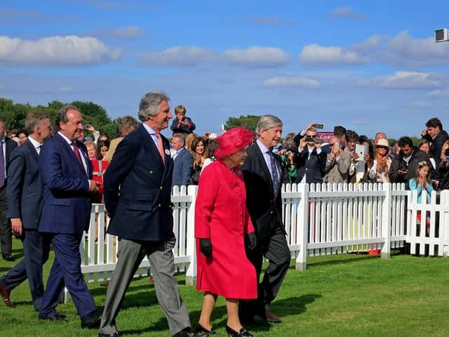 Queen Elizabeth ll walking with group Queen Elizabeth ll walking with group shows her health